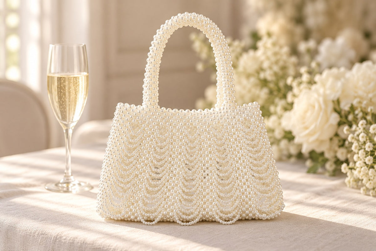 Ivory faux-pearl tassel handbag on a wedding table.
